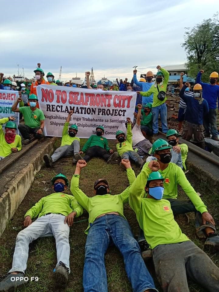 Shipyard workers hold a protest rally against the proposed reclamation project in Consolacion town, north Cebu