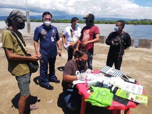 Police account for the items they seized from a young man from Talipao, Sulu after a drug buy-bust operation in Barangay Arena Blanco, Zamboanga City. Photo from Zamboanga City Police Office