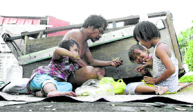 Photo of a family living on the sidewalk for story:Poor need ample aid, not corrupt-prone Maharlika wealth fund, gov’t told