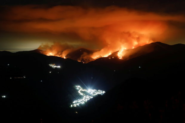 Spain says 'monster' fire under control after 7 days