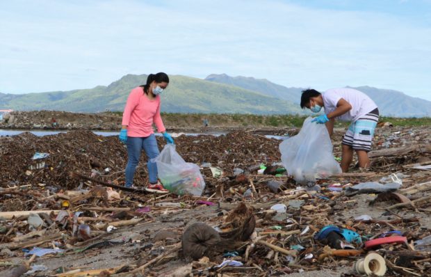  Volunteers in Subic Bay Freeport collect wastes and storm debris that wash up on shore. (Photo courtesy of the Subic Bay Metropolitan Authority)
