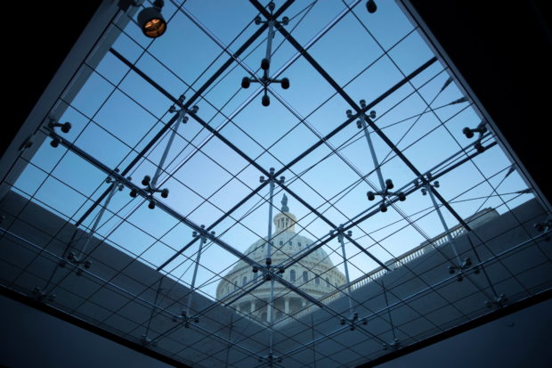 The U.S. Capitol seen through a skylight window at dusk on Capitol Hill in Washington, U.S., September 29, 2021. REUTERS/Tom Brenner