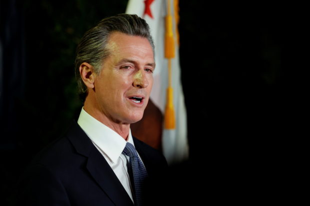 California Governor Gavin Newsom makes an appearance after the polls close on the recall election, at the California Democratic Party headquarters in Sacramento, California, U.S., September 14, 2021.  REUTERS/Fred Greaves