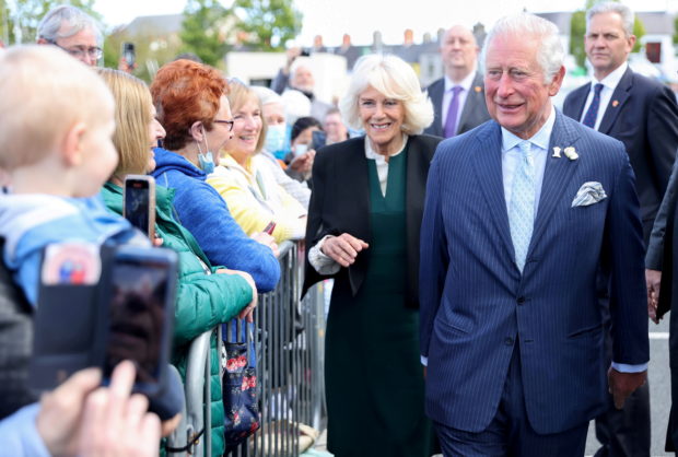 FILE PHOTO: Britain's Prince Charles and Camilla, Duchess of Cornwall, visit an open air market in Bangor