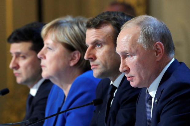 FILE PHOTO: Ukraine's President Volodymyr Zelenskiy, German Chancellor Angela Merkel, French President Emmanuel Macron and  Russia's President Vladimir Putin attend a joint news conference after a Normandy-format summit in Paris, France December 9, 2019. REUTERS/Charles Platiau/Pool; Normandy Summit Format on Ukraine in Paris