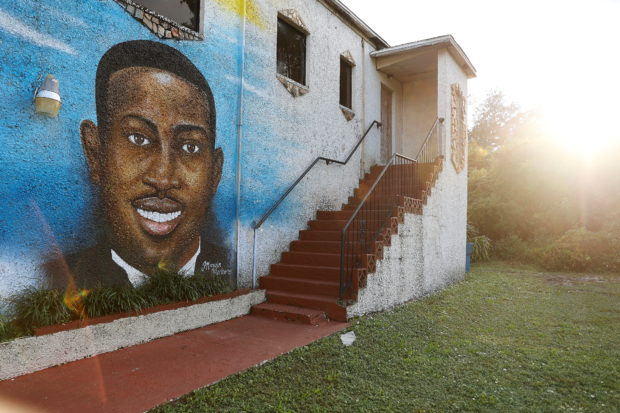 FILE PHOTO: A mural of Ahmaud Arbery is painted on the side of The Brunswick African American Cultural Center in downtown Brunswick, Georgia, U.S. October 11, 2021.  REUTERS/ Christopher Aluka Berry