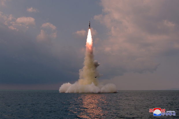 A new submarine-launched ballistic missile is seen during a test in this undated photo released on October 19, 2021 by North Korea's Korean Central News Agency (KCNA). KCNA via REUTERS