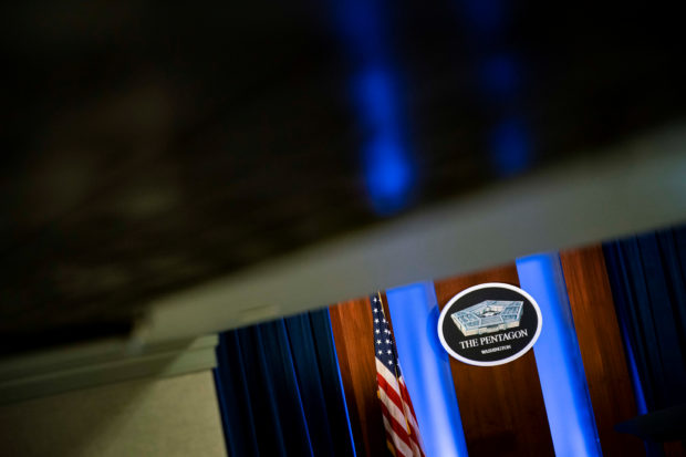 FILE PHOTO: The Pentagon logo is seen behind the podium in the briefing room at the Pentagon in Arlington, Virginia, U.S., January 8, 2020. REUTERS/Al Drago