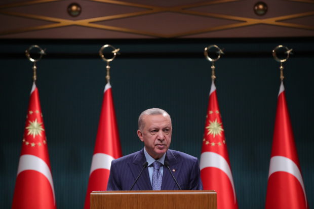 Turkish President Tayyip Erdogan addresses the media after a cabinet meeting in Ankara, Turkey, October 25, 2021. Murat Cetinmuhurdar/PPO/Handout via REUTERS