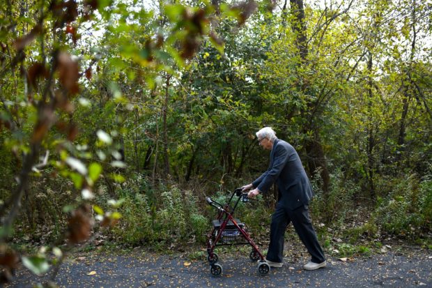 American biologist E.O. Wilson walks along a path in Lexington, Massachusetts, U.S., October 21, 2021. Picture taken October 21, 2021.  REUTERS/Gretchen Ertl