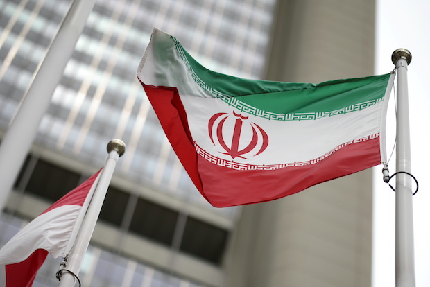 The Iranian flag flies in front of the U.N. nuclear watchdog (IAEA) headquarters in Vienna, Austria