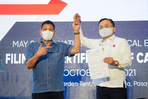 Rodrigo Duterte (left) and Bong Go