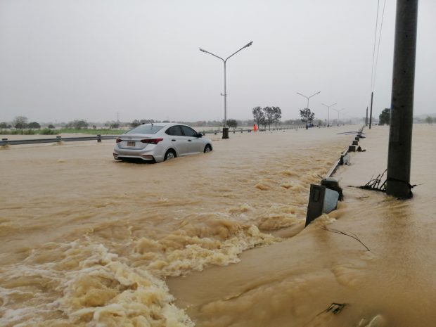 Floodwaters brought by Severe Tropical Storm "Maring" swamped a major diversion road in Candon City in Ilocos Sur province