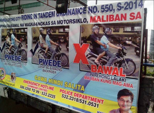A tarpaulin in Mandaluyong gave a fair warning pursuant to its ordinance against "riding-in-tandem". Image from Facebook / Daniel De Guerto Reyes 
