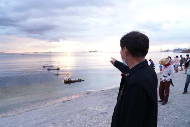 CIMATU WATCHES SUNSET AT REOPENED MANILA BAY DOLOMITE BEACH. Department of Environment and Natural Resources (DENR) Secretary and Manila Bay Task Force Chair Roy A. Cimatu watches the sunset during his visit to the Manila Baywalk Dolomite Beach on Sunday, Oct. 17, a day after it was reopened to the public. Cimatu said the beach area near the US Embassy is just the Phase 1 of the Beach Nourishment Project of the task force and the stretch of 500 meters from the said area will be covered with white sand.  The Manila Bay rehab is part of the DENR compliance with the Supreme Court Writ of Continuing Mandamus directing 13 government agencies and private entities to clean up, rehabilitate, and preserve Manila Bay, and to restore and maintain its waters to SB level that is fit for swimming, skin-diving, and other forms of contact recreation. ###