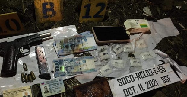 Authorities recovered these packs of “shabu” (crystal meth), guns, and marked money from two drug suspects killed in a reported shootout with policemen in Gapan City, Nueva Ecija
