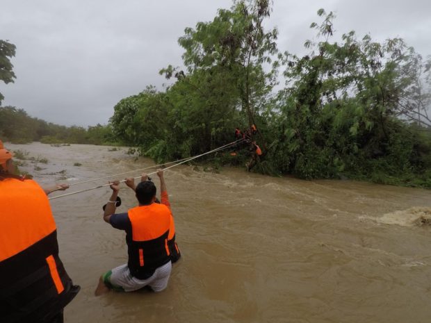 Villagers are evacuated Monday as the rising water of Wangag River threatens to submerge low-lying Barangay Taluro in Gonzaga town, Cagayan province at the height of Severe Tropical Storm "Maring."