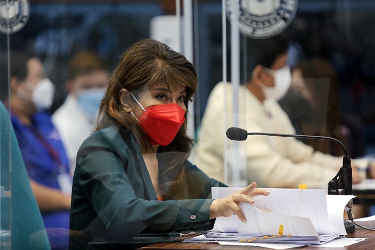 Senate Finance Committee vice chairperson Sen. Imee Marcos answers queries from colleagues as she defends the 2022 proposed budget of the Department of Social Welfare and Development (DSWD) and its attached agencies during the continuation of the marathon hybrid plenary session Tuesday, November 23, 2021.