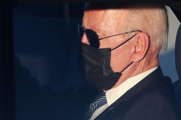 US President Joe Biden sits in The Beast Motorcade at Melsbroek Military Airport in Brussels, on June 13, 2021, ahead of the NATO Summit and EU-US summit. (Photo by YVES HERMAN / POOL / AFP)