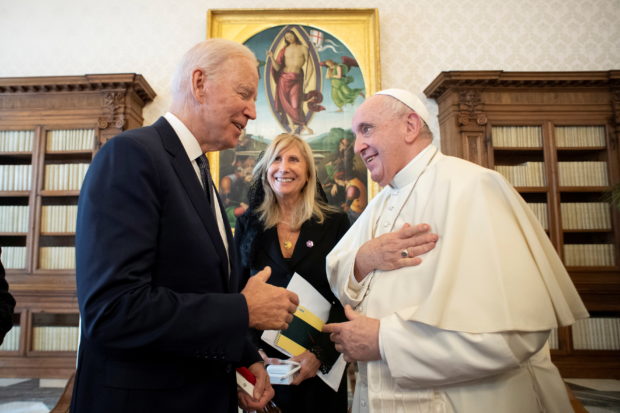 FILE PHOTO: Pope Francis meets U.S. President Joe Biden at the Vatican, October 29, 2021. Vatican Media/Handout via REUTERS
