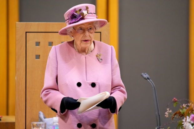 FILE PHOTO: Britain's Queen Elizabeth delivers a speech inside the Siambr (Chamber) during the ceremonial opening of the Sixth Senedd in Cardiff, Britain October 14, 2021. Andrew Matthews/Pool via REUTERS