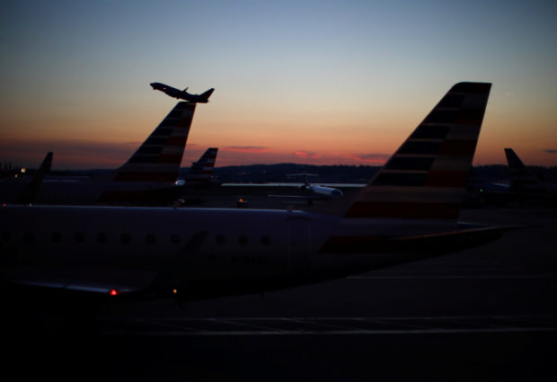 FILE PHOTO: An airplane takes off from the Ronald Reagan National Airport as air traffic is affected by the spread of the coronavirus disease (COVID-19), in Washington, U.S., March 18, 2020. REUTERS/Carlos Barria