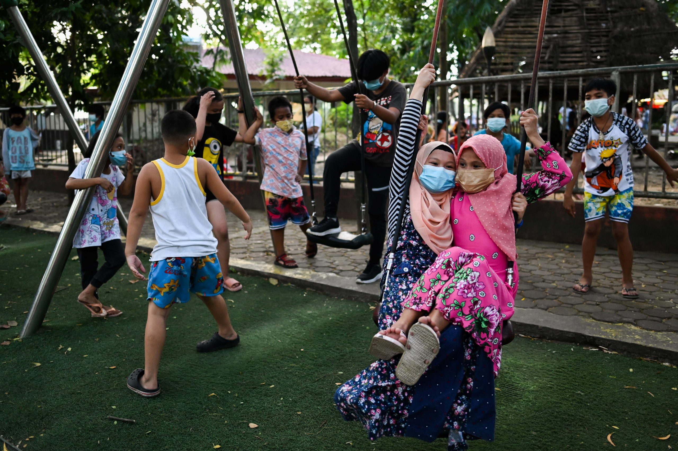 Children play at a public park, as the country's capital region loosens coronavirus disease (COVID-19) restrictions, in Quezon City, Metro Manila, Philippines, November 2, 2021. Picture taken November 2, 2021. REUTERS/Lisa Marie David