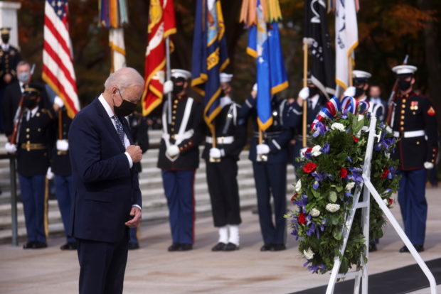 U.S. President Joe Biden attends a wreath laying ceremony to mark Veterans Day and the centennial anniversary of the Tomb of the Unknown Soldier at Arlington National Cemetery in Arlington, Virginia, U.S., November 11, 2021. REUTERS/Leah Millis