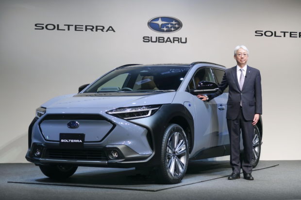 Subaru Corp. President and CEO Tomomi Nakamura stands next to the first all-electric vehicle (EV) Solterra during an unveiling event in Tokyo, Japan November 11, 2021, in this photo taken by Kyodo. Mandatory credit Kyodo/via REUTERS