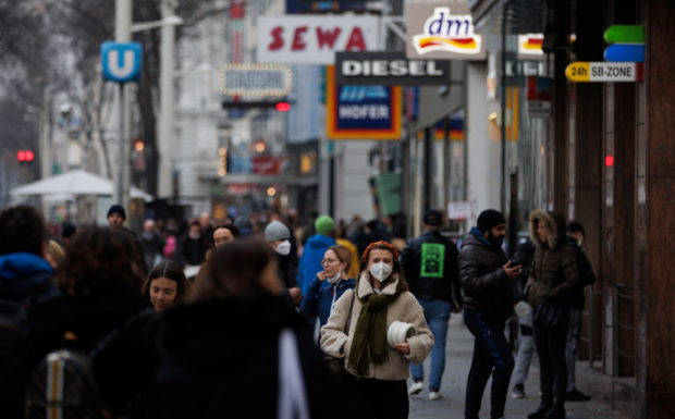 Pedestrians walk along a shopping street after the Austrian government placed roughly two million people who are not fully vaccinated against the coronavirus disease (COVID-19) on lockdown, in Vienna, Austria, November 15, 2021. REUTERS/Lisi Niesner