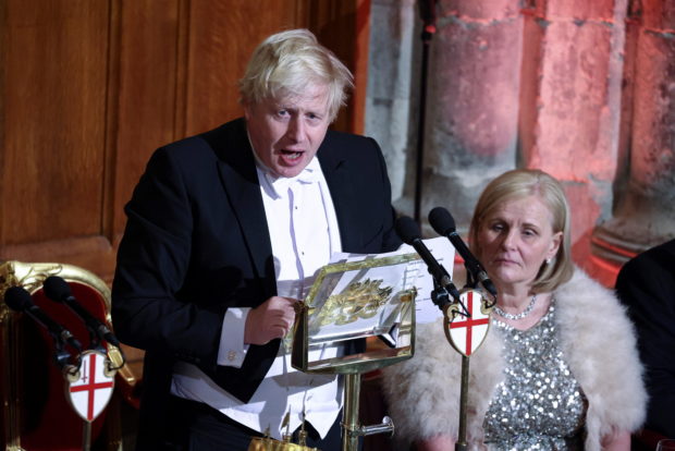 Britain's Prime Minister Boris Johnson speaks at the annual Lord Mayor's Banquet at Guildhall in London, Britain, November 15, 2021. REUTERS/Tom Nicholson