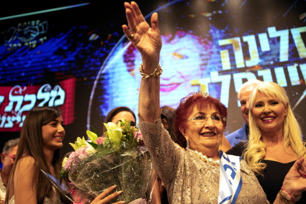 86-year-old Salina Steinfeld is crowned "Miss Holocaust Survivor" at the annual Holocaust survivors' beauty pageant in Jerusalem November 16, 2021. REUTERS/Nir Elias