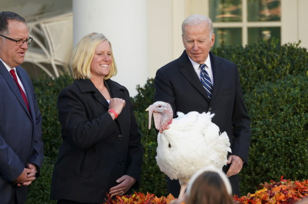 U.S. President Joe Biden pardons the national Thanksgiving turkey, Peanut Butter, as he participates in the 74th National Thanksgiving Turkey Presentation in the Rose Garden at the White House in Washington, U.S., November 19, 2021. REUTERS/Kevin Lamarque     