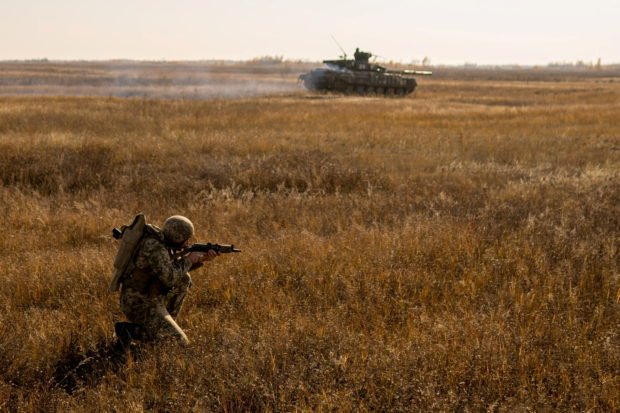 FILE PHOTO: A serviceman of the Ukrainian Armed Forces takes part in military drills at a training ground near the border with Russian-annexed Crimea in Kherson region, Ukraine, in this handout picture released by the General Staff of the Armed Forces of Ukraine press service November 17, 2021. Press Service of General Staff of the Armed Forces of Ukraine/Handout via REUTERS