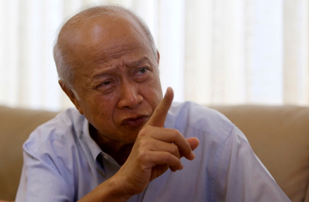 Prince Norodom Ranariddh gestures during an interview with Reuters at his home in central Phnom Penh