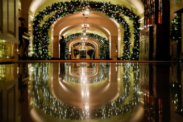 A White House Military Social Aide stands in the Center Hall during a press tour of White House Christmas decorations ahead of holiday receptions by U.S. President Joe Biden and first lady Jill Biden in Washington, U.S. November 29, 2021.  REUTERS/Jonathan Ernst