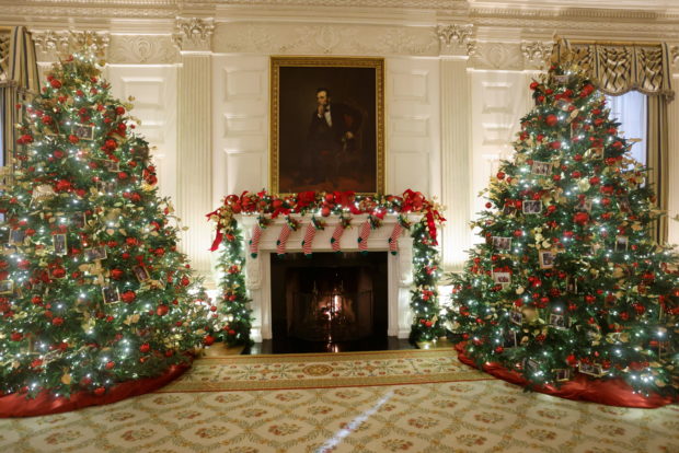 Christmas trees in the State Dining Room are decorated with snapshots of U.S. presidents and their families during a press tour of White House Christmas decorations ahead of holiday receptions by U.S. President Joe Biden and first lady Jill Biden in Washington, U.S. November 29, 2021.  REUTERS/Jonathan Ernst