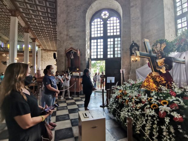 Devotees venerate the image of the Black Nazarene at Our Lady of Assumption Shrine in Dauis town, Bohol