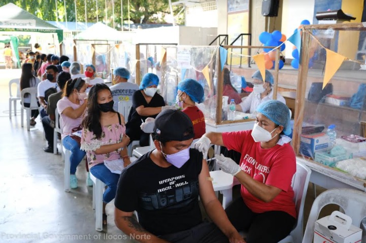 Ilocos Norte residents receive COVID-19 vaccines during the first day of the three-day national vaccination drive