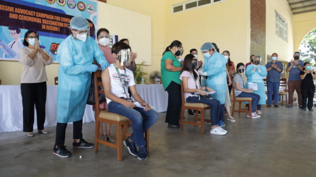 Students in Mariano Marcos State University in Ilocos Norte province get inoculated against COVID-19