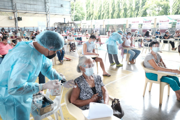 Ilocos Norte residents getting COVID-19 vaccination. STORY: Use expiring COVID-19 vax doses in house-to-house drive – Duterte