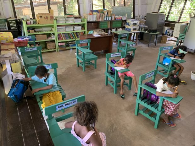 Grade 3 students return to the Owaog Nebloc Elementary School in Botolan, Zambales, during the pilot run of the in-person classes