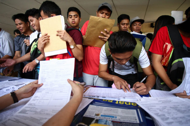 People troop to a Labor Day fair to apply for jobs and the government bats for a review of the education curriculum in order to address job mismatch in the country