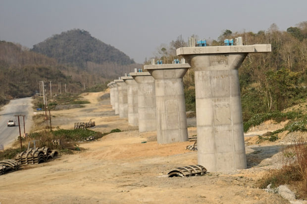 This picture taken on February 8, 2020 shows a part of the first rail line linking China to Laos, a key part of Beijing's 'Belt and Road' project across the Mekong, in Luang Prabang. - From an artificial island in Sri Lanka to a bridge in Bangladesh and hydropower projects in Nepal and Indonesia, China's trillion-dollar Belt and Road plan is stuttering under the effects of the deadly coronavirus. (Photo by Aidan JONES / AFP) / TO GO WITH Health-virus-diplomacy-trade-China-
