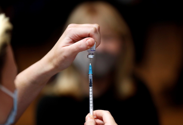 A nurse prepares a vaccination at the Hartlepool Town Hall Theatre vaccination centre, as the spread of the coronavirus disease (COVID-19) continues in Hartlepool