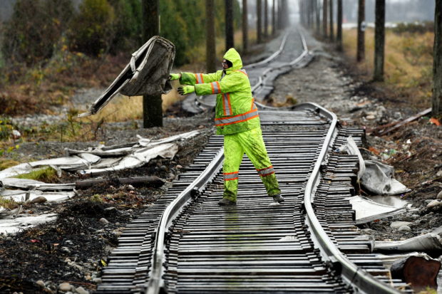 Cleanup crews remove debris after rainstorms lashed the western Canadian province, triggering landslides and floods, shutting highways, in Abbotsford, British Columbia, Canada November 30, 2021. REUTERS/Jennifer Gauthier