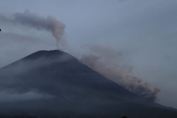 Mount Semeru spews hot clouds as seen from Pronojiwo, Lumajang, East Java province, Indonesia December 5, 2021, in this photo taken by Antara Foto/Ari Bowo Sucipto/via REUTERS.