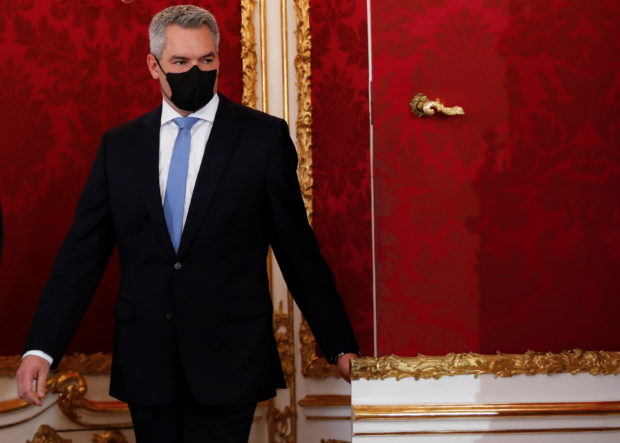 Austria's third leader in two months takes office seeking stability