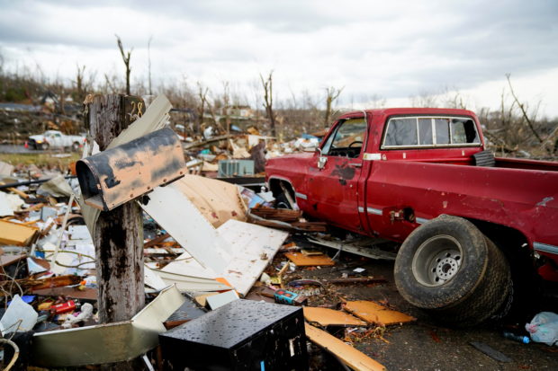 A mailbox stands in front of where a home once stood after a devastating outbreak of tornadoes ripped through several U.S. states in Earlington, Kentucky, U.S. December 11, 2021. REUTERS/Cheney Orr