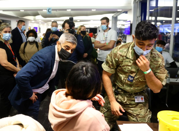 Mayor of London, Sadiq Khan visits a coronavirus disease (COVID-19) pop-up vaccination centre at Chelsea football ground, Stamford Bridge in London, Britain, December 18, 2021. REUTERS/David Klein